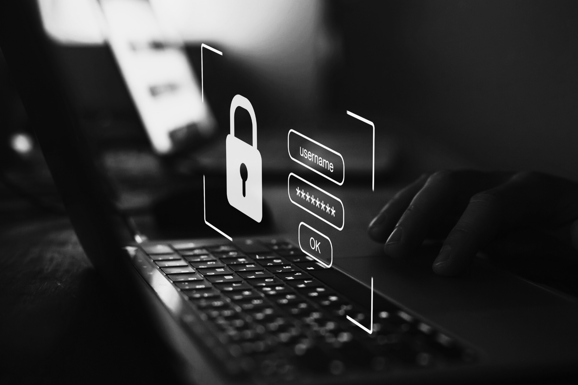 Login-Maske mit Passwortfeld über Laptop-Tastatur symbolisiert IT-Sicherheit im Software-Testing-Prozess.